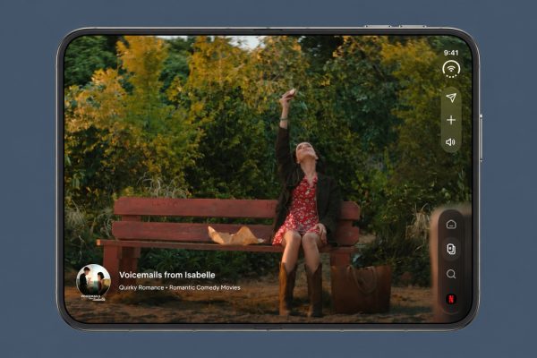 iPhone Duo displaying Netflix on its unfolded screen against a muted blue-gray background
